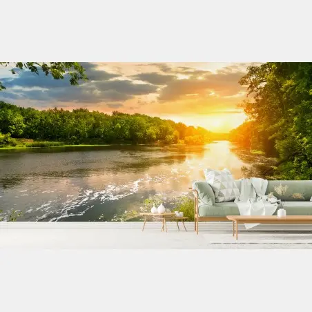 Wall mural serene riverside sunset over lush forest • Wallissimo®