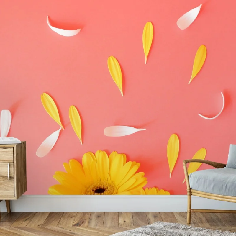 Wall mural sunny yellow gerbera on coral background