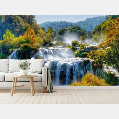 Wall mural cascading waterfall in lush forest • Wallissimo®
