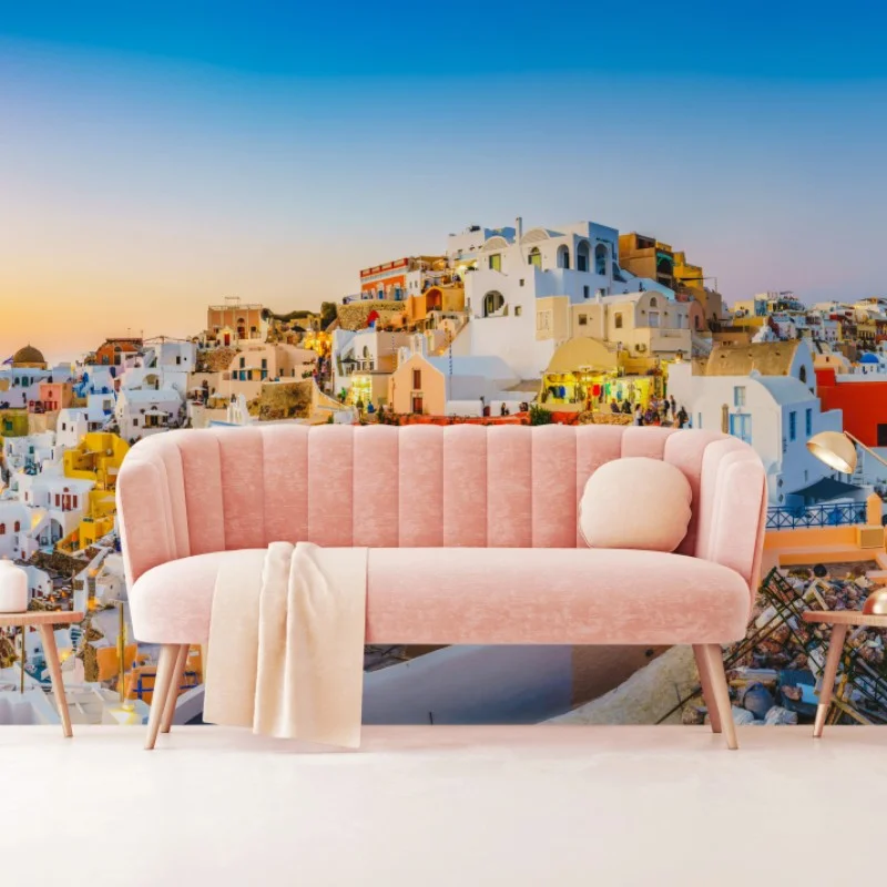 Wall mural sunset over Santorini village panoramic view