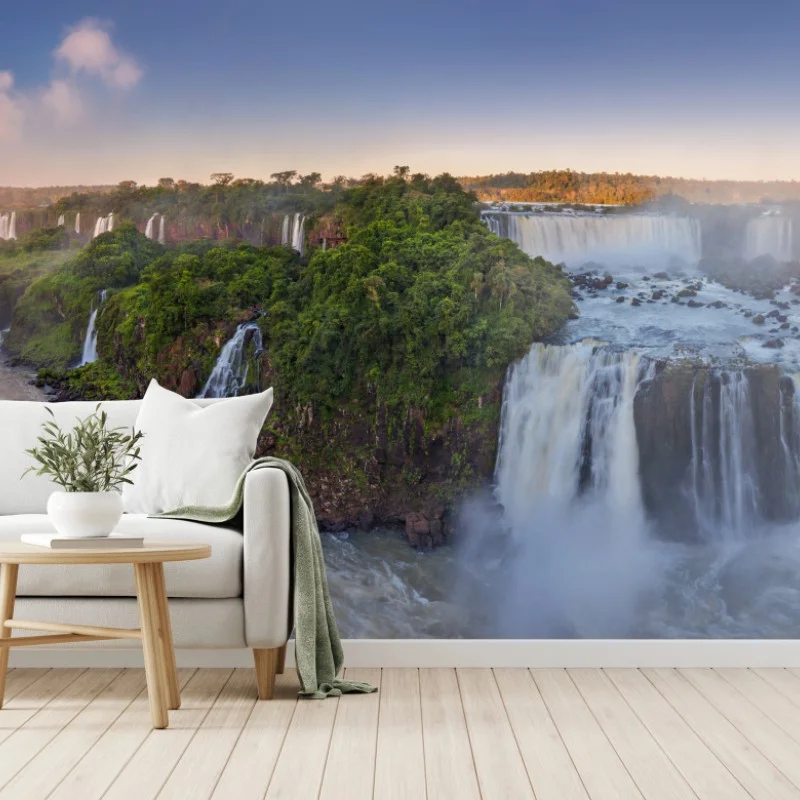 Wall mural misty waterfall panorama in lush forest