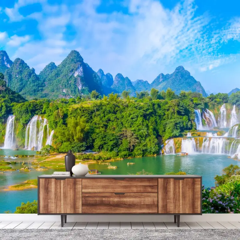 Wall mural lush waterfall panorama with karst mountains