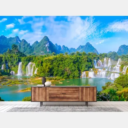Wall mural lush waterfall panorama with karst mountains • Wallissimo®