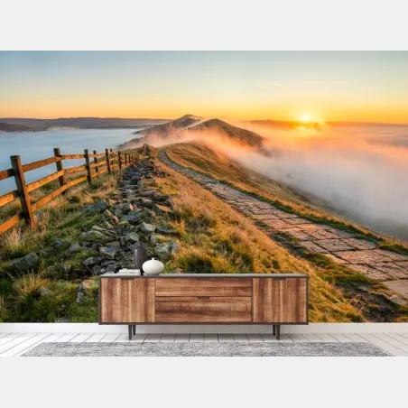 Wall mural sunrise over a misty ridge with a stone path • Wallissimo®