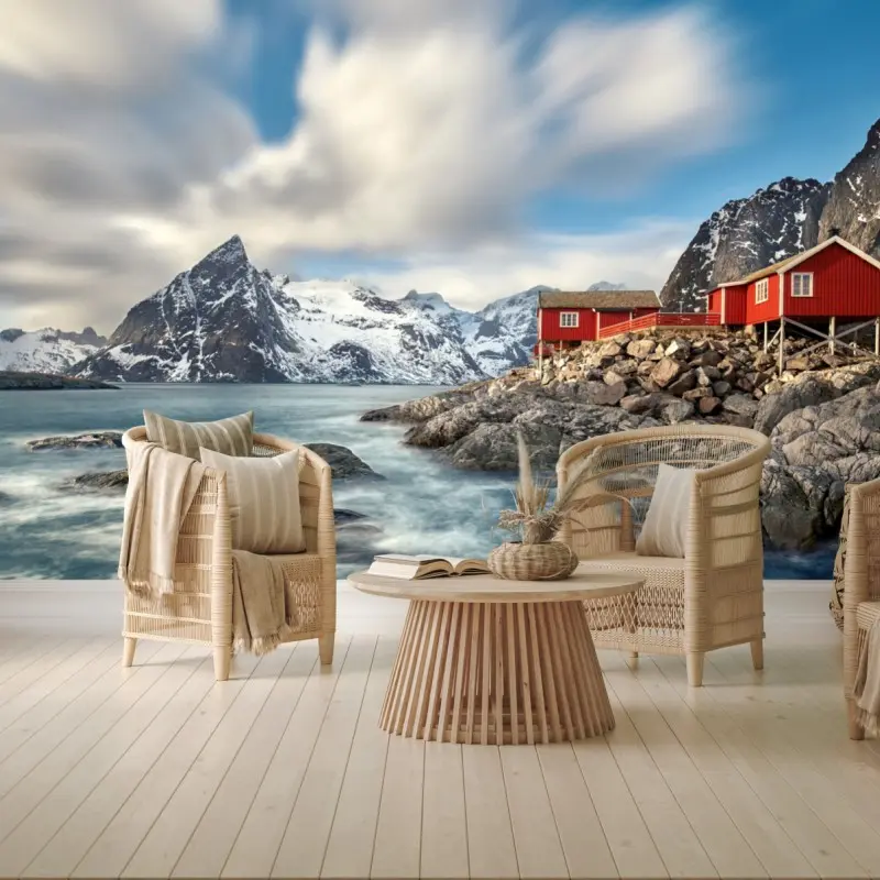 Wall mural red cabins by snowy coastal mountains