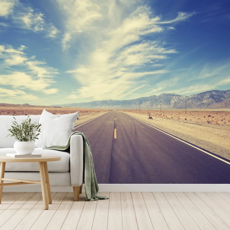 Wall mural vintage country highway under vast sky