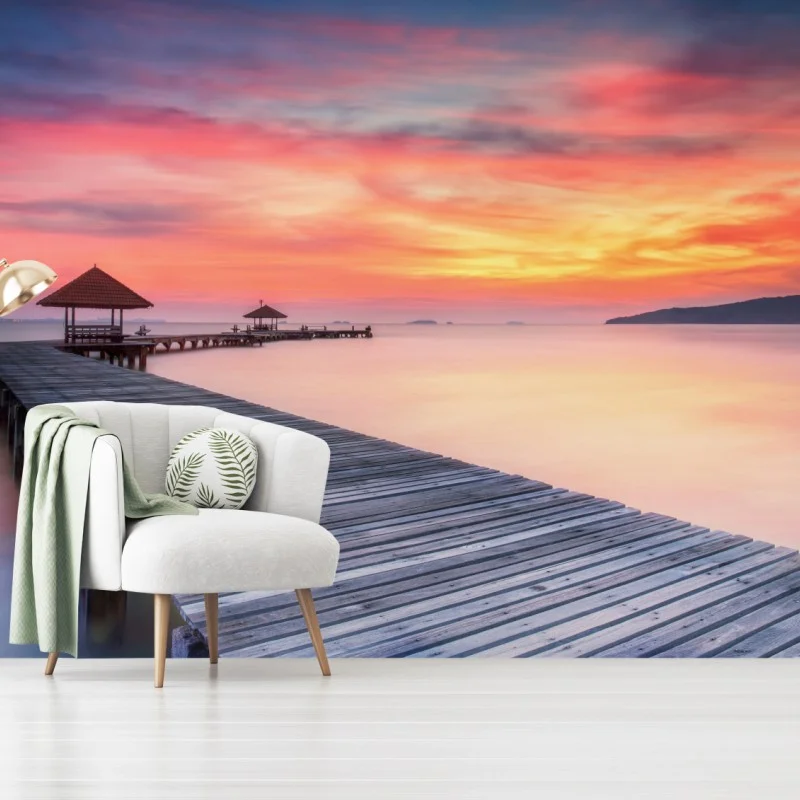 Wall mural serene sunrise over wooden pier