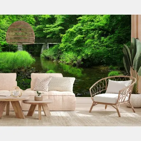 Wall mural lush green forest stream with stone bridge • Wallissimo®