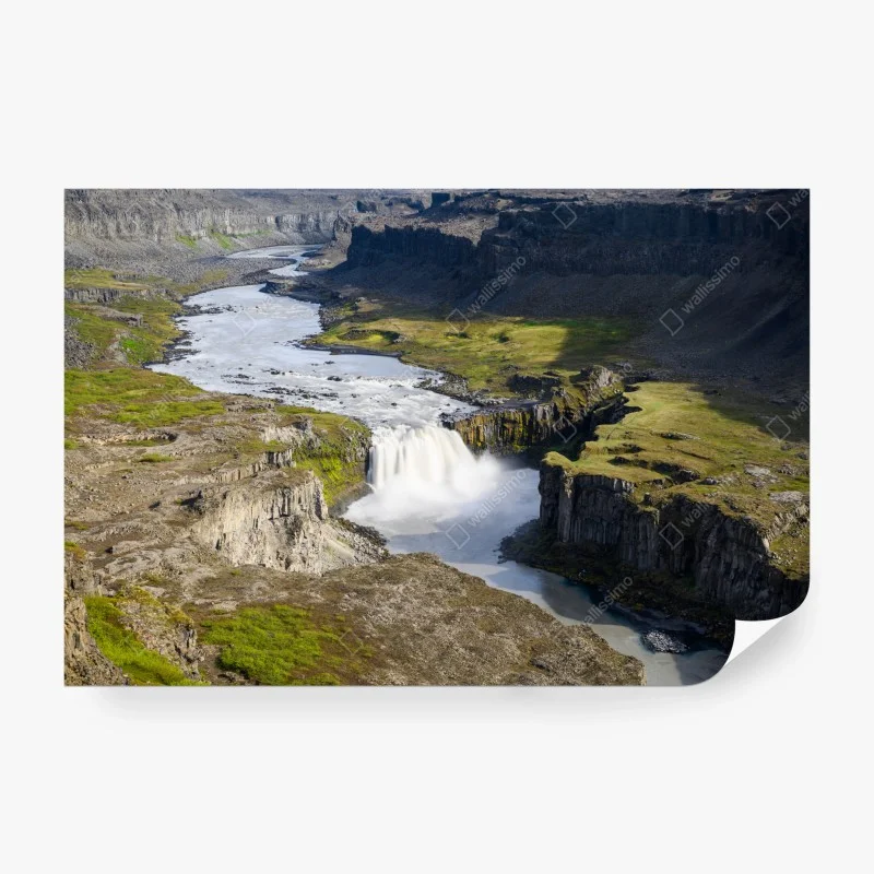 Wall mural majestic waterfall in Icelandic canyon