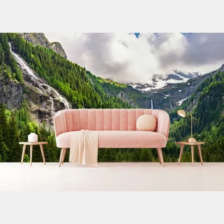 Wall mural misty alpine waterfalls over lush pine valley • Wallissimo®