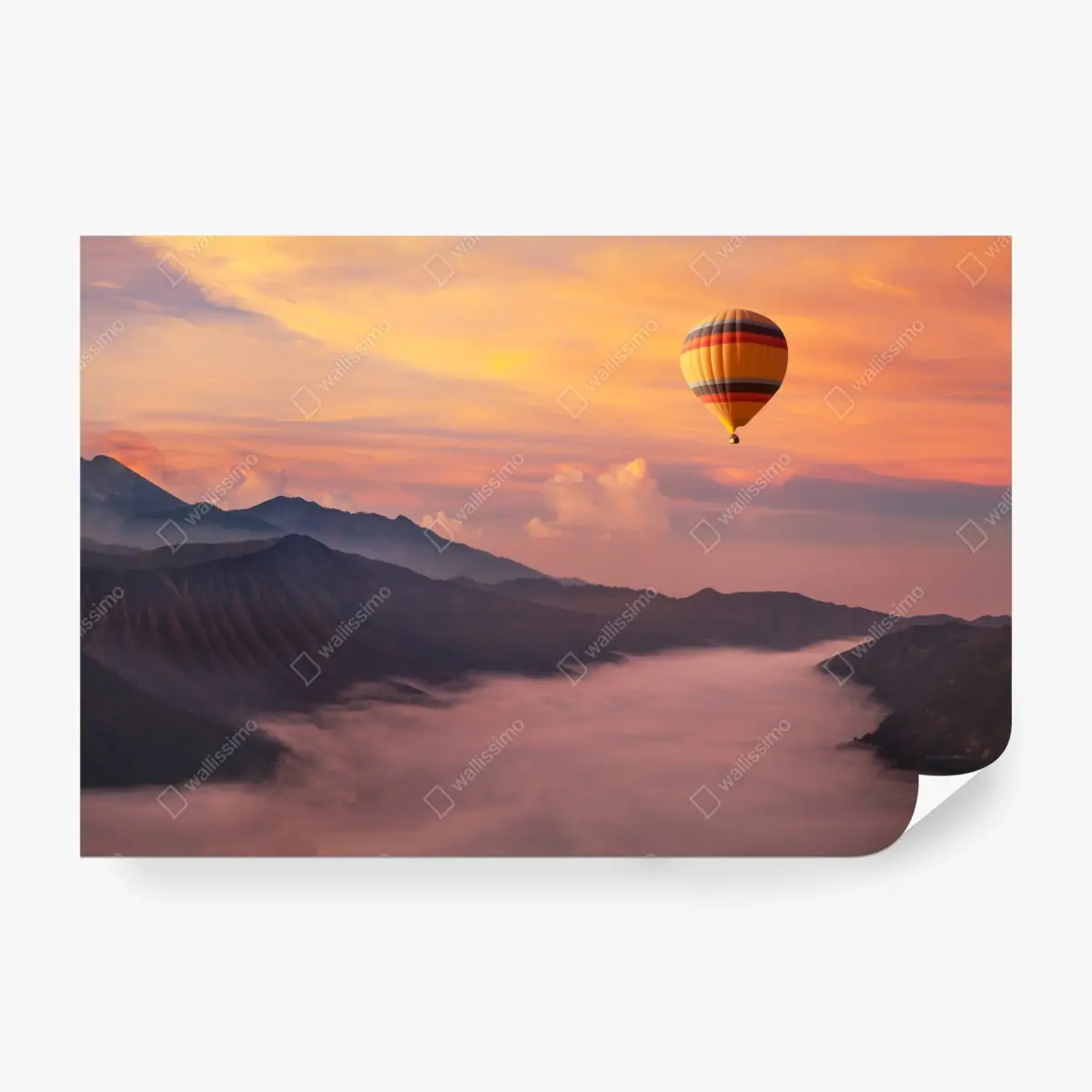 Wall mural sunrise balloon over misty mountains • Wallissimo®