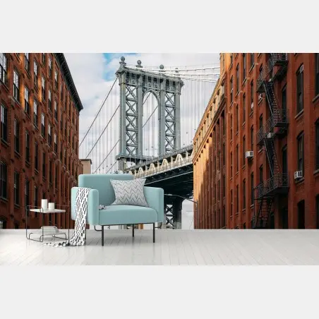 Wall mural Brooklyn bridge framed by brick buildings at sunset • Wallissimo®