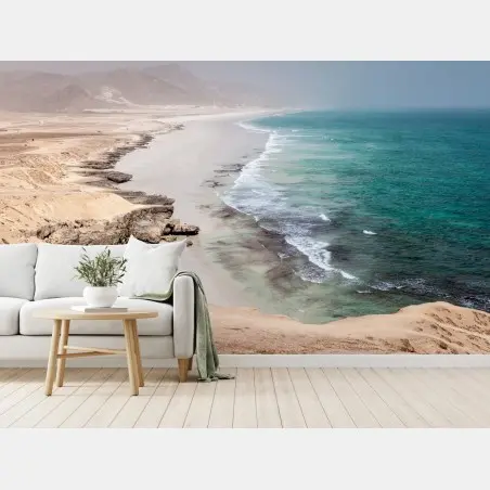Wall mural serene turquoise coastline over desert cliffs • Wallissimo®