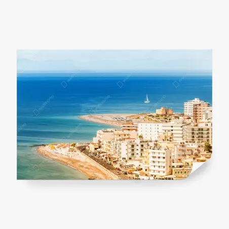 Wall mural sunny coastal cityscape with sailboat • Wallissimo®
