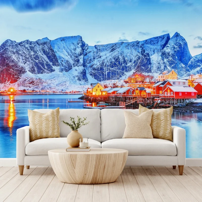 Wall mural snowy coastal village beneath towering mountains