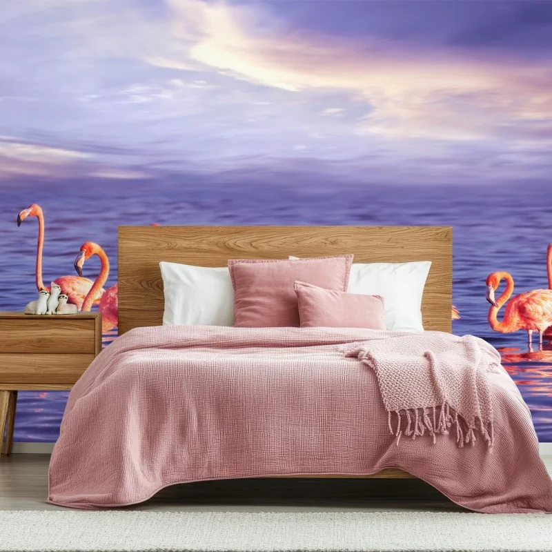 Wall mural pink flamingos in purple sunset