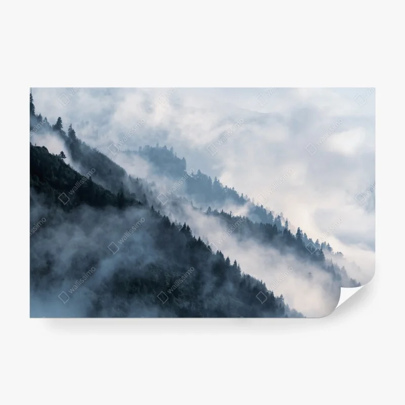 Wall mural mist-covered mountain ridges