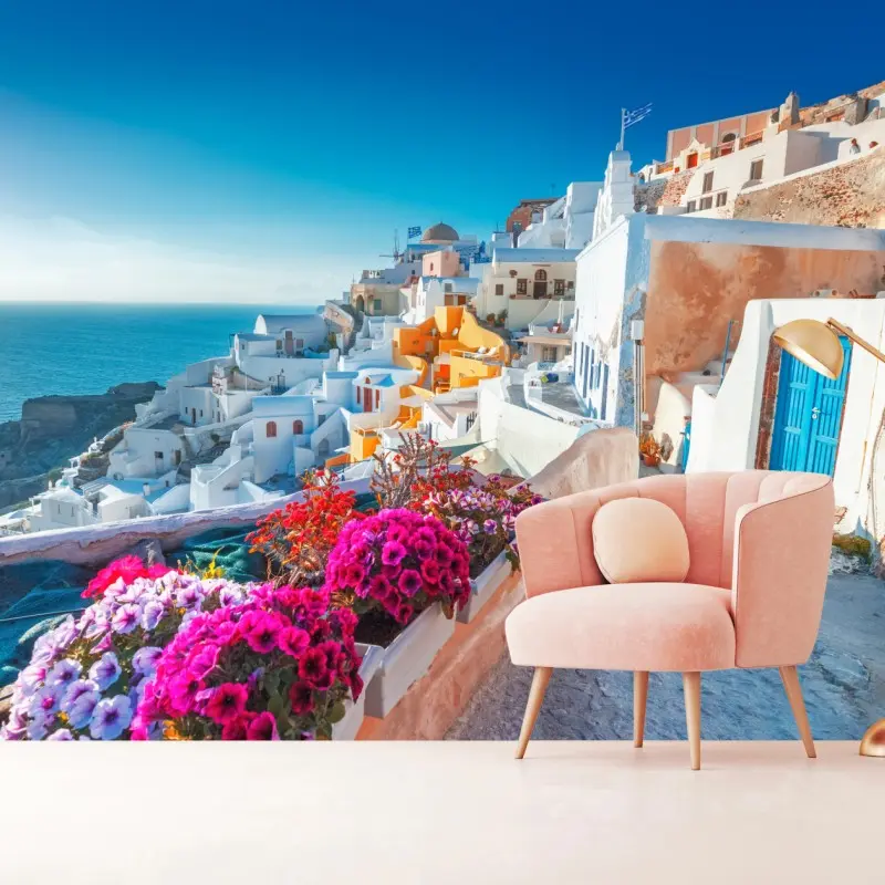 Wall mural sunlit Santorini cliffside village
