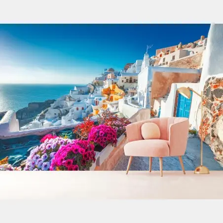 Wall mural sunlit Santorini cliffside village • Wallissimo®