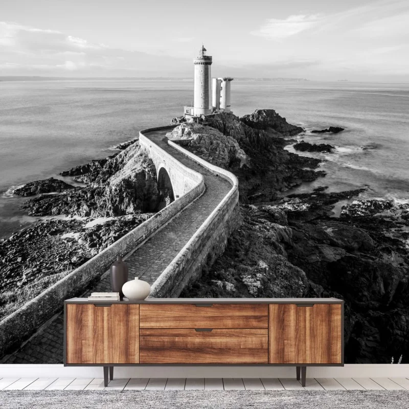 Wall mural lighthouse on rocky coast pathway