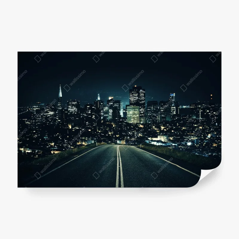 Wall mural road to illuminated city skyline at night