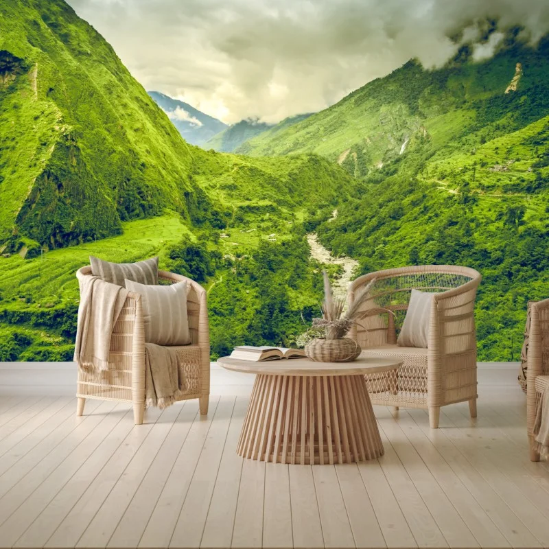 Wall mural lush green mountain valley with river