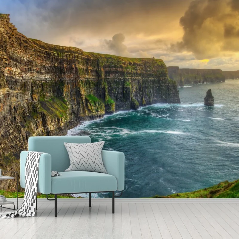 Wall mural dramatic coastal cliffs at sunset