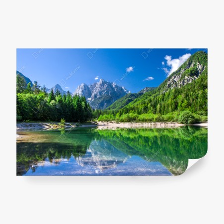 Wall mural alpine lake reflection in green mountains • Wallissimo®