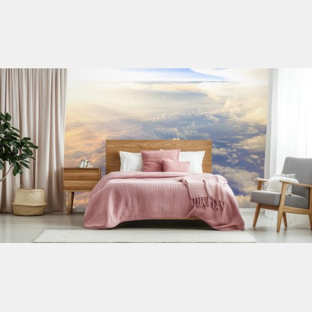 Wall mural sunlit clouds above the horizon • Wallissimo®