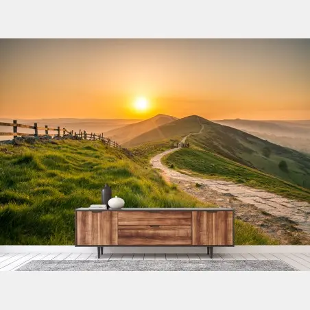 Wall mural sunrise over rolling green hills • Wallissimo®