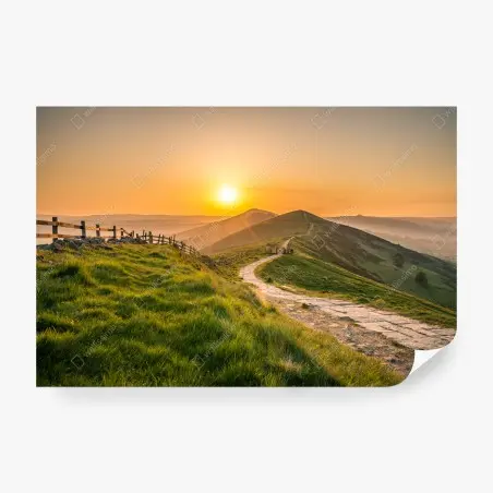 Wall mural sunrise over rolling green hills • Wallissimo®