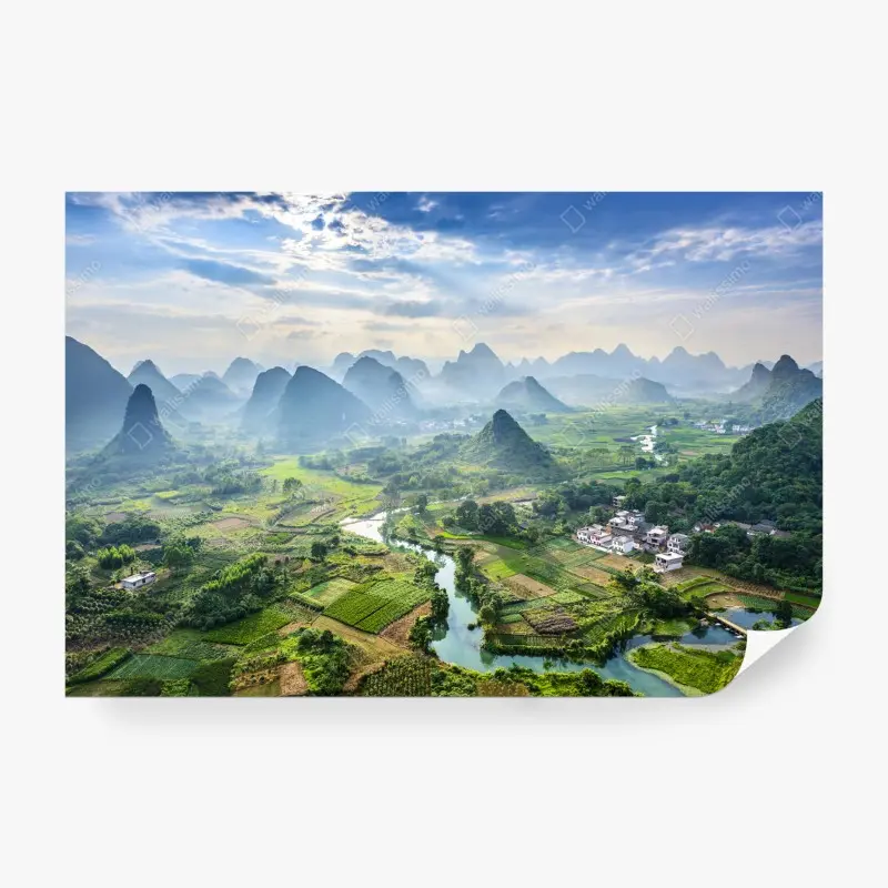Wall mural misty karst mountain valley at sunrise