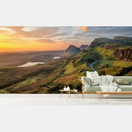 Wall mural sunset over rolling green hills • Wallissimo®
