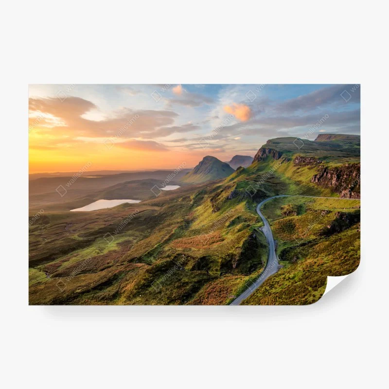 Wall mural sunset over rolling green hills