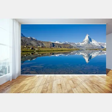Wall mural alpine mountain reflection over calm lake • Wallissimo®