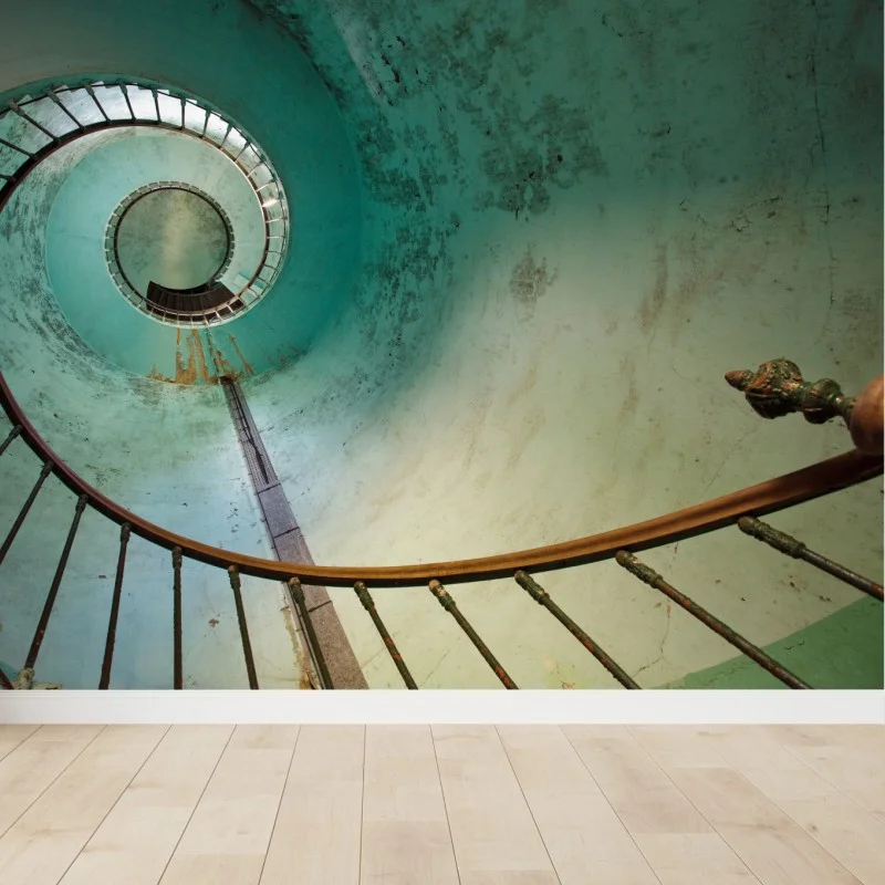 Wall mural turquoise spiral staircase in a historic stairwell