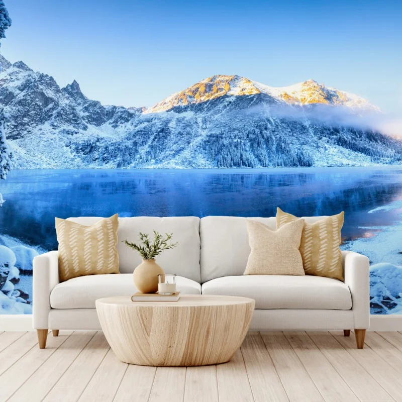 Wall mural winter sunrise over frozen mountain lake