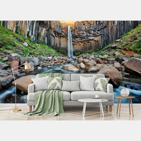Wall mural dramatic waterfall amid basalt cliffs • Wallissimo®