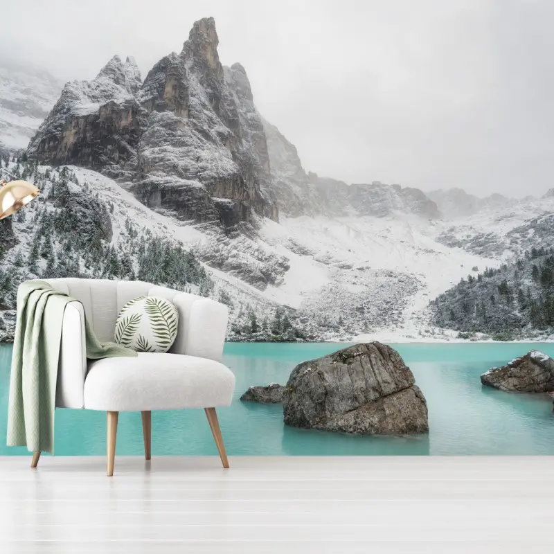 Wall mural turquoise alpine lake under snowy peaks