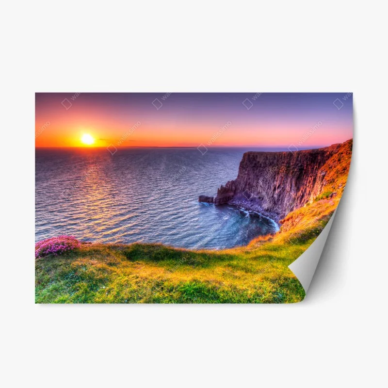 Repositionable sticker sunset over rugged coastal cliffs
