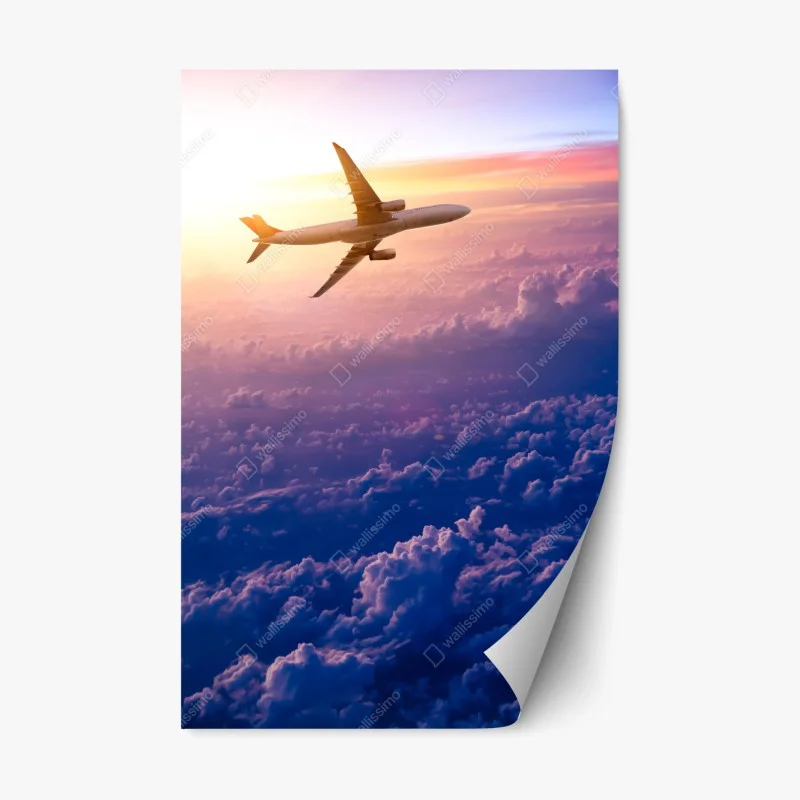 Repositionable sticker airplane above clouds at sunrise