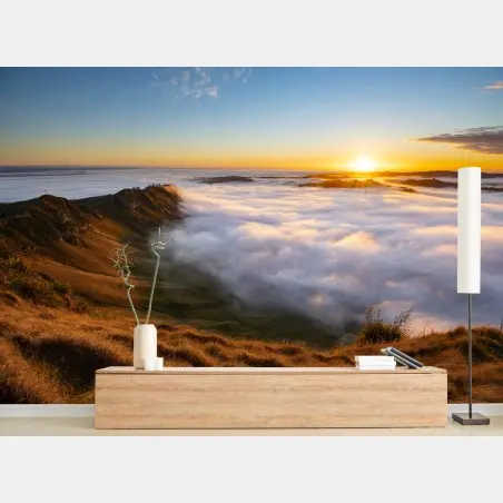 Wall mural sunrise over misty mountain valley • Wallissimo®