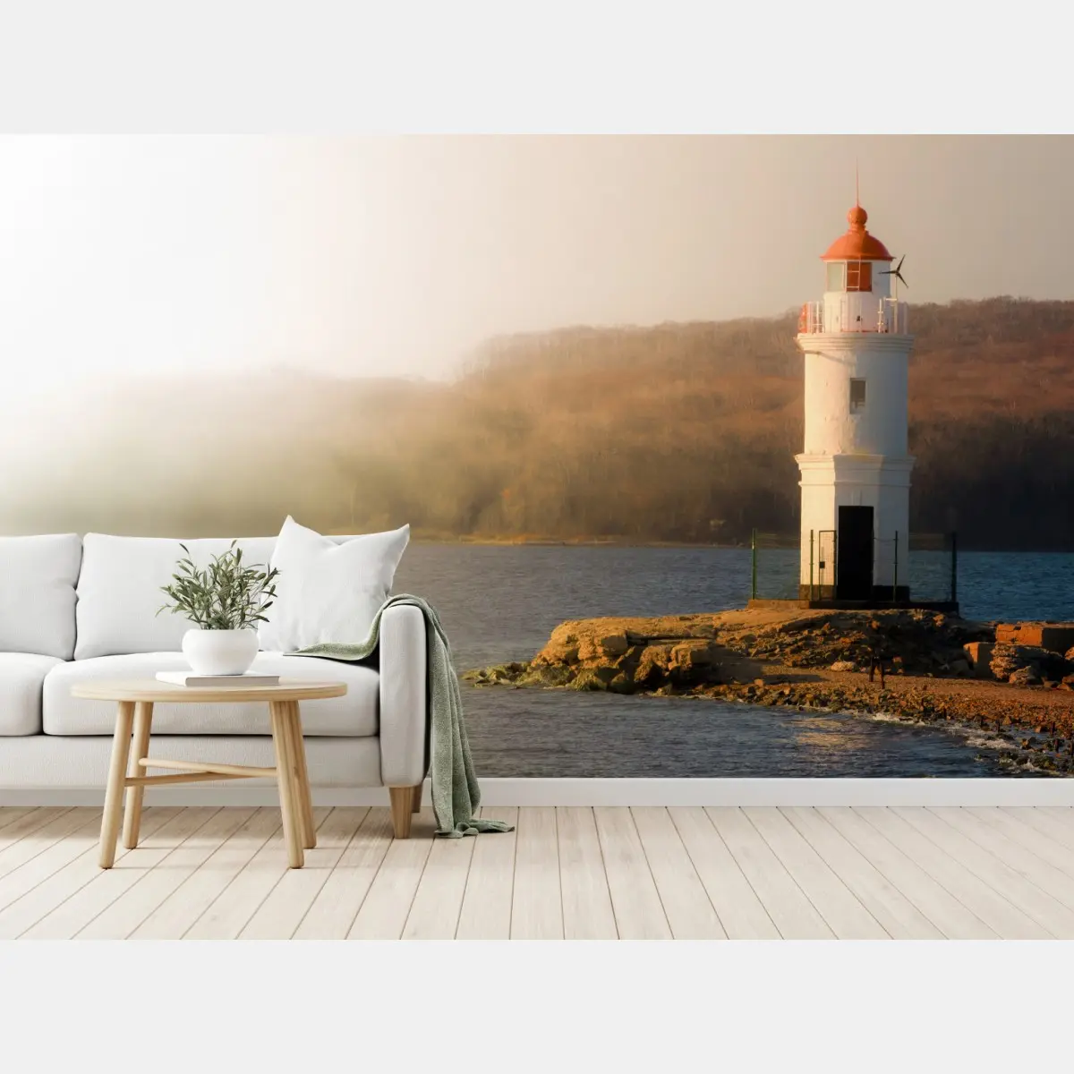 Wall mural sunlit lighthouse on misty shore • Wallissimo®