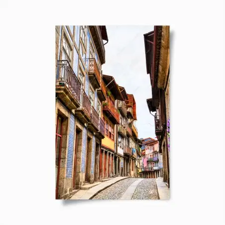 Poster charming cobblestone street with colorful facades • Wallissimo®