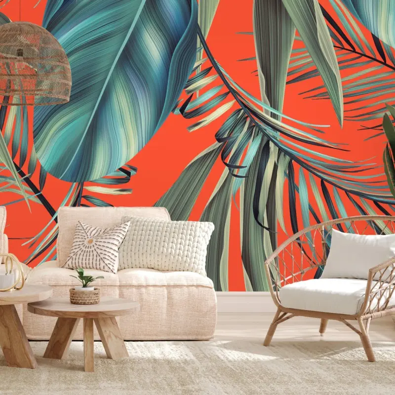 Wall mural tropical turquoise leaves on orange background