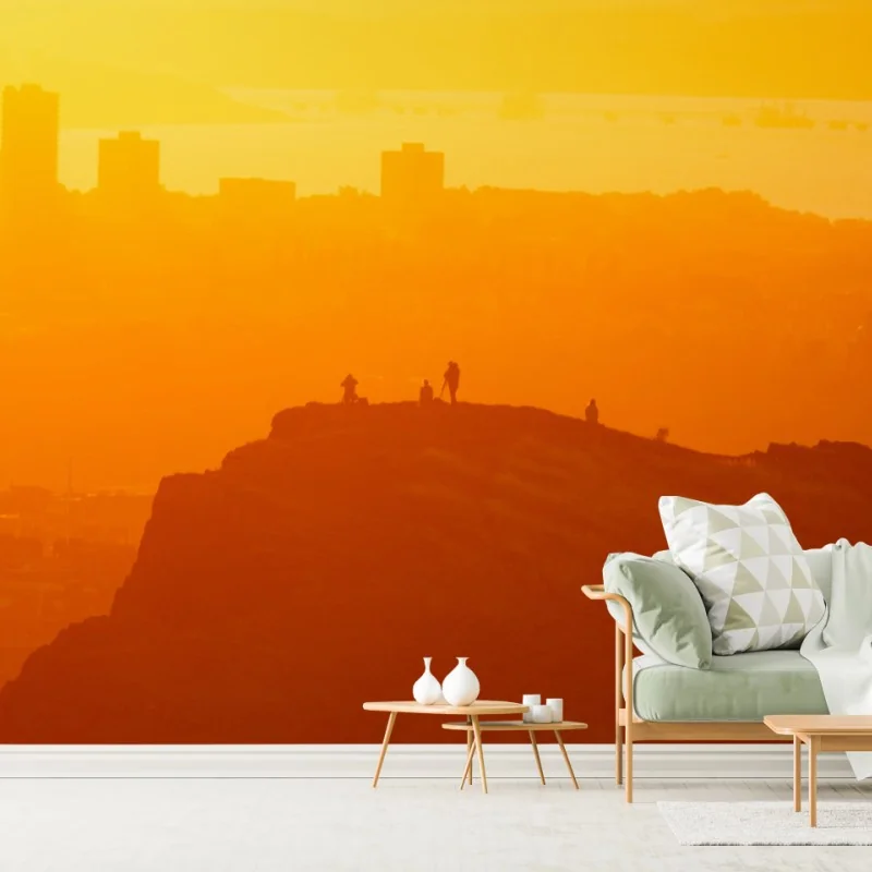 Wall mural golden sunset silhouette over cliffs