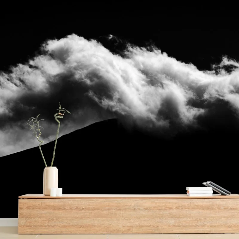 Wall mural moody cloud silhouette over mountain