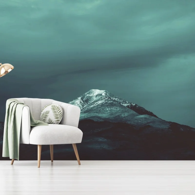 Wall mural turquoise mountain under a moody sky