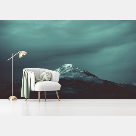 Wall mural turquoise mountain under a moody sky • Wallissimo®