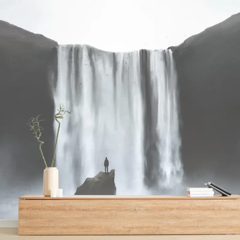 Wall mural silhouette at a misty waterfall